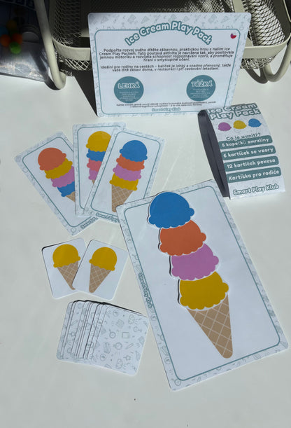 Ice cream-themed play cards and activity sheets on a white surface.